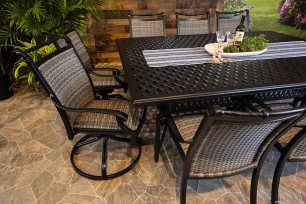 Glenhaven Bimini Aluminum Outdoor Dining 60x84 Weave Table with 6 Stationary and 4 Swivel Chairs